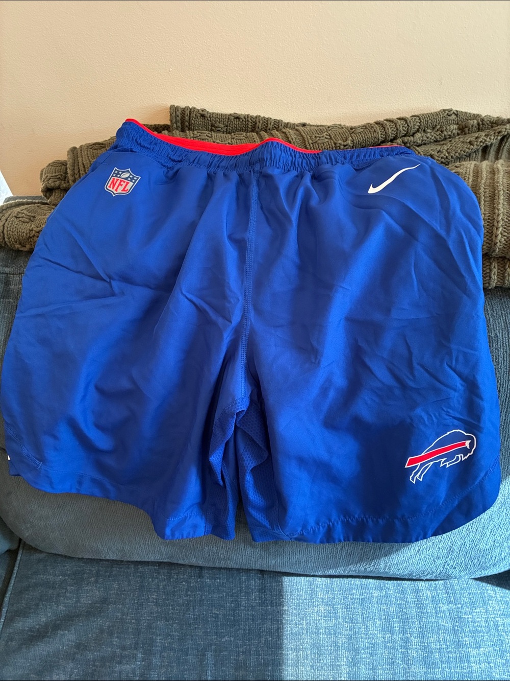 Nike Blue Men's Athletic Shorts with White Swoosh and Red Waist Trim
